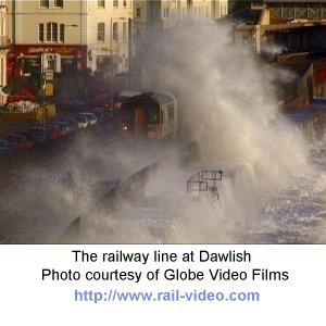 Waves break over a train at Dawlish